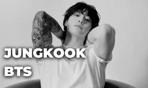 Jungkook z BTS, z tatuażami na ramieniu, w białej koszulce. Czy Jungkook z BTS ma dziewczynę?